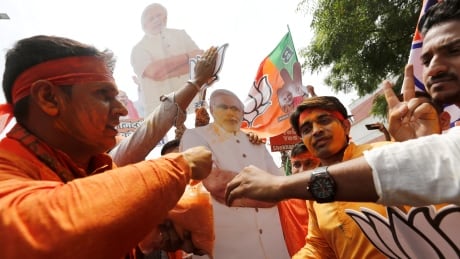 BJP supporters celebrate after learning the initial election results in New Delhi, India, May 23, 2019. INDIA-ELECTION/
