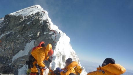 Unidentified mountaineers pause at the Hillary Step while pushing for the summit of Everest on May 19, 2009, as they climb the south face from Nepal. everest climbers archival