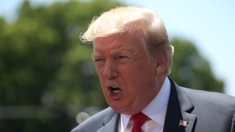 U.S. President Donald Trump talks to reporters outside the White House in Washington on Friday. The president has accused the FBI of illegal 'spying' against his 2016 presidential campaign. USA-TRUMP/