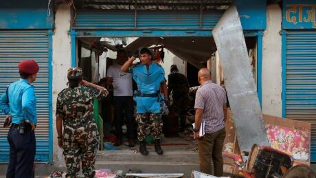 Security personnel inspect an explosion site in Kathmandu, Nepal May 26, 2019. REUTERS/Navesh Chitrakar - RC1A78FCEA30 NEPAL-BLASTS/
