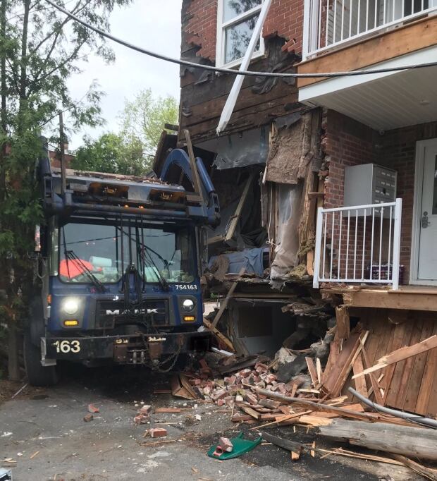 No one in cab of garbage truck that smashed into home | CBC News