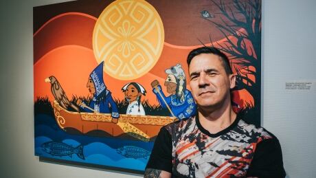 "He talks about our river being our traditional highway. We knew the river really well, we knew how to get around without using a map" Hassencahl-Perley said when describing Percy Sacobies work titled "Highways". Sacobie standing beside "Highways" Percy Sacobie