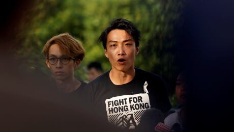 Members of Civil Human Rights Front Jimmy Sham speaks at a news conference in response to the announcement by Hong Kong Chief Executive Carrie Lam regarding the proposed extradition bill, outside the Legislative Council building in Hong Kong, China, June 15, 2019. REUTERS/Thomas Peter - RC132CBF9CD0 HONGKONG-EXTRADITION/