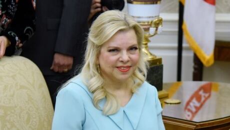 WASHINGTON, DC - MARCH 5: (AFP OUT) Wife of Israel Prime Minister Benjamin Netanyahu, Sara Netanyahu looks on as U.S. President Donald Trump and Israel Prime Minister Benjamin Netanyahu meet in the Oval Office of the White House March 5, 2018 in Washington, DC. The prime minister is on an official visit to the US until the end of the week. (Photo by Olivier Douliery-Pool/Getty Images) 927653840