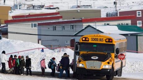 Nunavut's former language commissioner is expressing anger over proposed changes to the Education Act, passed in 2008, that promises all Inuit children guaranteed access to bilingual education by 2019 so as to produce graduates equally fluent in Inuktut and English. Students board a school bus at the Nakasuk Elementary School in Iqaluit, Nunavut, in a March 30, 2009, file photo. THE CANADIAN PRESS/Nathan Denette Inuit Education Threat 20170319