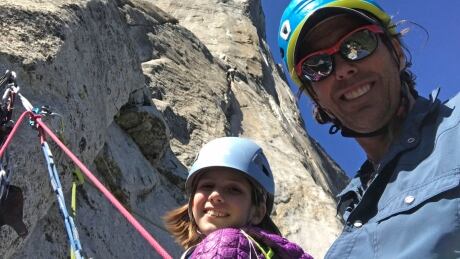 In this June 8, 2019, photo, is Michael Schneiter posing with his daughter, Selah Schneiter, at the beginning of her climb up El Capitan in Yosemite National Park, Calif. A 10-year-old Colorado girl has scaled Yosemite National Park's El Capitan, taking five days to reach the top of the iconic rock formation. Selah Schneiter of Glenwood Springs completed the challenging 3,000-foot (910 meters) climb last week with the help of her father and a family friend. Yosemite Child Rock Climber