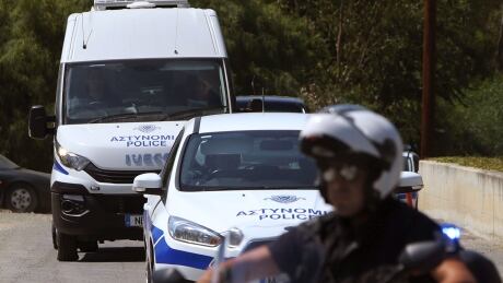 A motorcyclist police officer escorts and guards the police van carrying Nicholas Metaxas from the court to the Cypriot central prison in capital Nicosia, Cyprus. Metaxas tearfully apologized to the families of seven foreign-born women and girls after pleading guilty to a dozen charges of premeditated murder and kidnapping. Cyprus Slayings