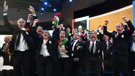 Members of the delegation of Milan/Cortina d'Ampezzo bid react after it was elected to host the 2026 Olympic Winter Games on Monday.
1151697541