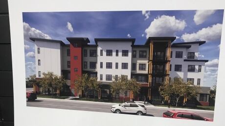 A placard at a B.C. Housing meeting in Kelowna shows what a 49 unit supportive housing building will look like on McCurdy Road in the city's Rutland neighbourhood Rutland Supportive Housing