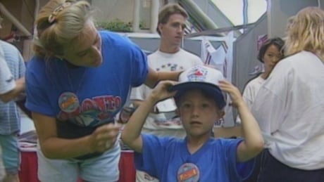 There was lots and lots of All-Star Game merchandise available for purchase in 1991. Woman and young boy in All-Star Game gear