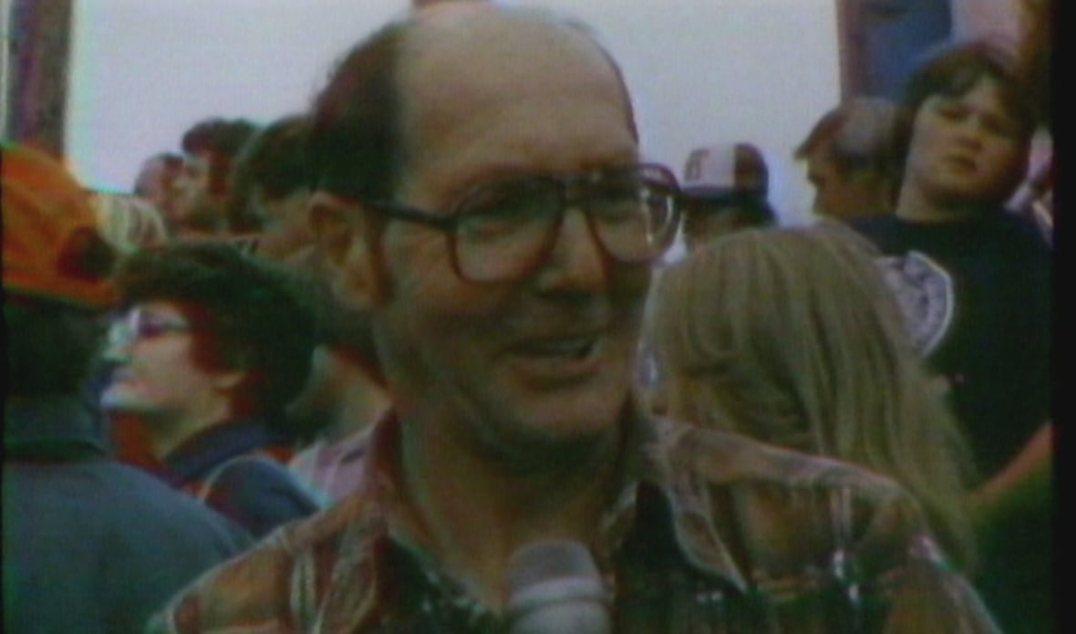 smiling man wearing glasses