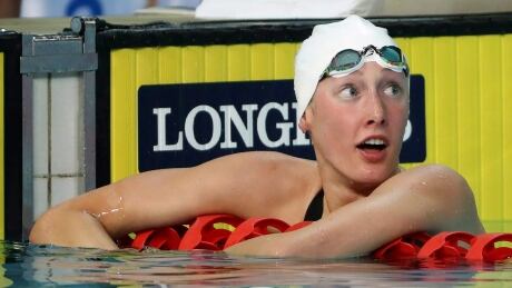 Canada's Taylor Ruck reacts after winning the women's 200m freestyle final at the 2018 Commonwealth Games, one of her record eight medals at the event. ruck-taylor-070919
