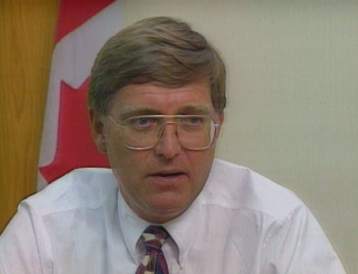 Man in shirt, tie and glasses
