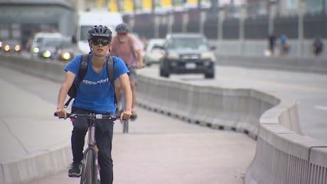 Despite criticism over having a permanent bike lane on the Burrard Street Bridge in 2009, the lane has become the most used one for cyclists in North America. Cyclist Burrard Street Bridge bike lane Sunday 14 July 2019