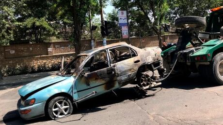 A damaged car is towed away from the site of an explosion in Kabul, Afghanistan, Friday, July 19, 2019. A powerful bomb exploded outside the gates of Kabul University in the Afghan capital on Friday, according to police and health officials. (AP Photo) Afghanistan