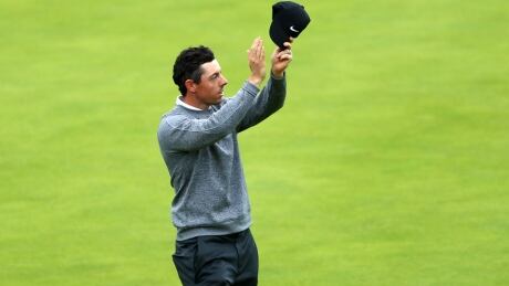 Rory McIlroy of Northern Ireland acknowledges the crowd as he walks up the 18th fairway at Royal Portrush Golf Club. The hometown favourite missed the cut despite shooting a 65 on Friday. 1163023355
