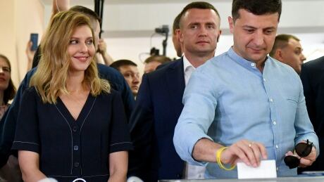 Ukrainian President Volodymyr Zelenskiy, and his wife Olena Zelenska cast their ballots at a polling station during a parliamentary election in Kiev, Ukraine, Sunday, July 21, 2019. Ukrainians are voting in an early parliamentary election in which the new party of President Volodymyr Zelenskiy is set to take the largest share of votes. Ukraine Election