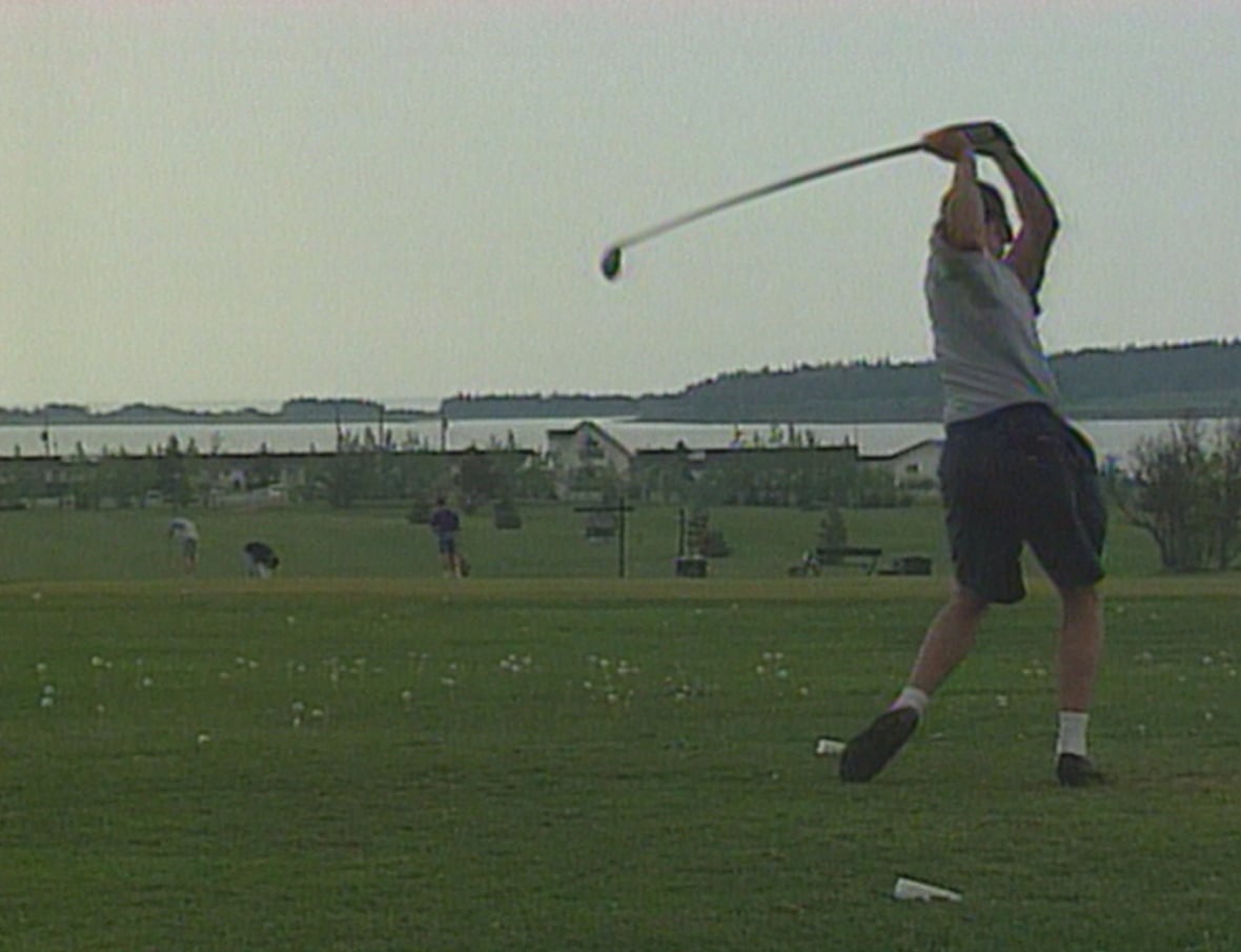 A golfer getting set to tee off
