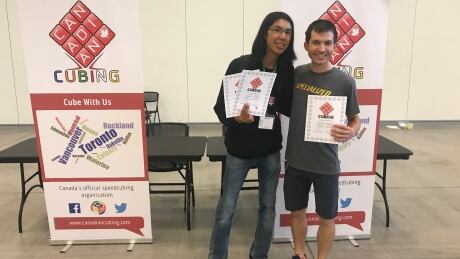 Walter Duff, left, with fellow cuber Louis Cormier. Duff won first in the Skewb event and third place in the 2X2X2 event Walter Duff, Louis Cormier, Canadian Cubing Championships