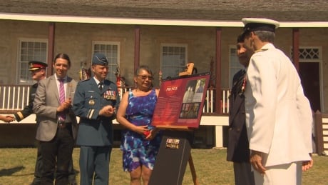 Family members and dignitaries celebrate the unveiling of a plaque in honour of decorated war hero, Tommy Prince. Plaque Tommy Prince