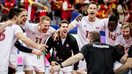 Members of the Canadian men's volleyball team celebrate their three-set sweep of Finland on Sunday at an Olympic qualifying tournament in Ningbo, China. Despite a 2-1 record over the weekend, Canada failed to win its pool to clinch a berth in the 2020 Olympic tournament but can still qualifying in the coming months. canada-volleyball-190811-1180