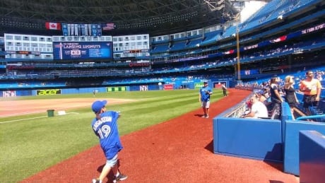 Taron warms up before the game with his father in Rogers Centre in Toronto where the Blue Jays played against Taron's second favorite team the New York Yankees. Taron Kaiswatum