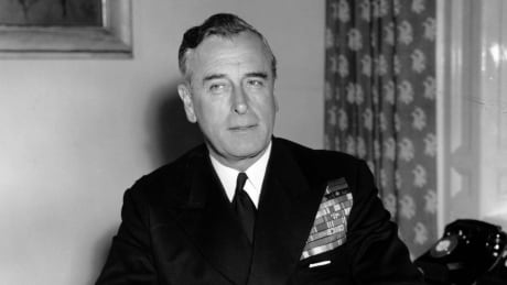 In this April 22, 1955 file photo, British Admiral Earl Louis Mountbatten sits at his desk in full uniform for the first time at the Admirality in London. Louis Mountbatten, seen in London, in April 22, 1955 file photo