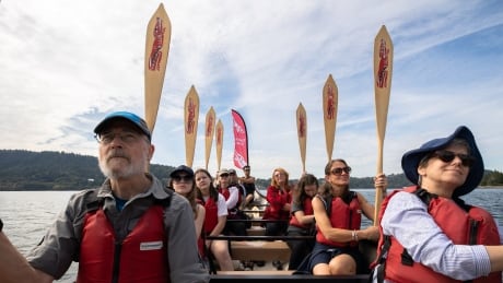 Paddlers on a Takaya First Nation canoe tour take a break from paddling in North Vancouver. First Nation's canoe tour