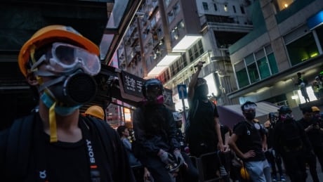 HONG KONG, CHINA - AUGUST 17: Protesters use laser pointers outside a police station during a stand-off in Mongkok district on August 17, 2019 in Hong Kong, China. Pro-democracy protesters have continued rallies on the streets of Hong Kong against a controversial extradition bill since 9 June as the city plunged into crisis after waves of demonstrations and several violent clashes. Hong Kong's Chief Executive Carrie Lam apologized for introducing the bill and declared it "dead", however protesters have continued to draw large crowds with demands for Lam's resignation and completely withdraw the bill. 1162054492