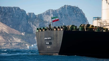Renamed Adrian Aryra 1 super tanker hosting an Iranian flag sails in the waters in the British territory of Gibraltar, Sunday, Aug. 18, 2019. Authorities in Gibraltar on Sunday rejected the United States' latest request not to release a seized Iranian supertanker, clearing the way for the vessel to set sail after being detained last month for allegedly attempting to breach European Union sanctions on Syria. APTOPIX Gibraltar Persian Gulf TensionS