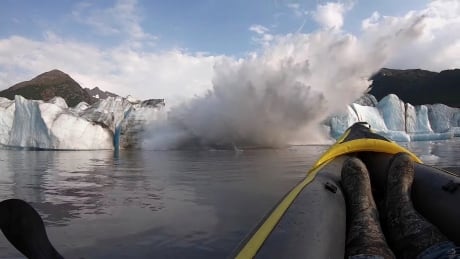 The Spencer Glacier collapses, forming a big wave moments before it crashes into a kayaker, in Alaska, U.S., August 10, 2019, in this still image taken from a video obtained from social media. ALASKA-GLACIER/