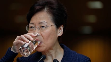 Hong Kong Chief Executive Carrie Lam drinks water during a press conference in Hong Kong Tuesday, Aug. 20, 2019. Lam said she’s setting up a “communication platform” to resolve differences in the Chinese city, which has been wracked by months of chaotic anti-government protests. She also said a fact-finding study will look at the causes of the protests and the police response to them. (AP Photo/Vincent Yu) Hong Kong Protests Leader