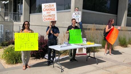 Members of Earth Strike Vernon protest outside of Tolko Industries' head office on Monday. Earth Strike Vernon