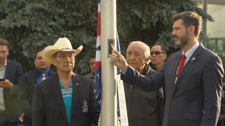 Wilton Littlechild, Grand Chief of Treaty No. 6 and Mayor Don Iveson prepare to raise the Treaty 6 flag outside city hall on Friday. Treaty 6 flag reconciliation day Edmonton