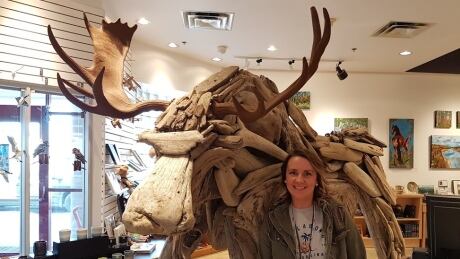 Artist Michelle Pringle poses with her driftwood creation, Sturgill, at Peace Gallery North in Fort St. John, B.C. Sturgill and MIchelle