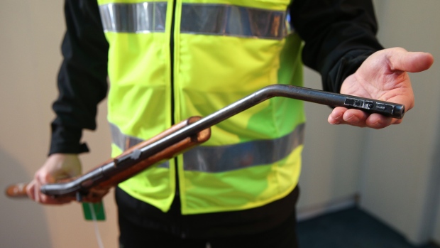 Canada tried to copy New Zealand's gun buyback program — what went wrong?; A gun is displayed after being destroyed using a hydraulic press during a firearm buy-back collection event on July 04, 2019 in Wellington, New Zealand\.