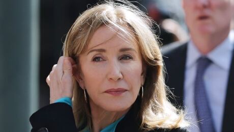 Actress Felicity Huffman is shown in April before a federal court appearance in Boston to face charges in a nationwide college admissions bribery scandal. She pleaded guilty to a single count of conspiracy and fraud in May. College Admissions-Bribery