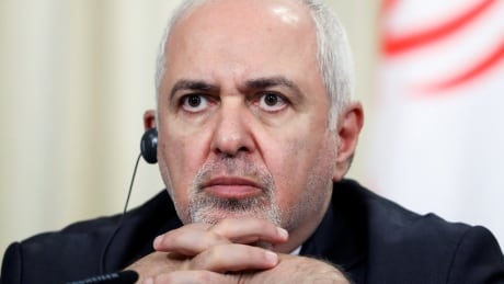 Iran's Foreign Minister Javad Zarif, seen here in this Sept. 2 file photo, warned Thursday that any attack on his country over a strike on Saudi Arabia's oil industry will result in 'all-out war.' RUSSIA-IRAN/