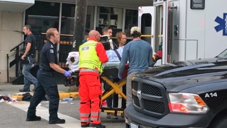 First responders transport a 29-year-old woman to hospital after an apparently random stabbing in Nelson, B.C. Nelson stabbing