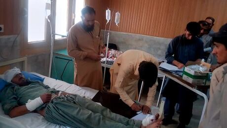 A victim in a bus accident is treated at a hospital in Chilas, northwest Pakistan, Sunday, Sept. 22, 2019. Pakistani police say a bus has rammed into a hill after it breaks failed on a mountainous road, killing some passengers and injuring more than a dozen in the country's northwest. (AP Photo/Muhammad Qasim) Pakistan Bus Crash