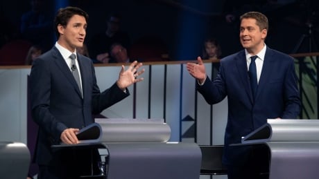 Liberal leader Justin Trudeau and Conservative leader Andrew Scheer take part in the the Federal leaders French language debate in Gatineau, Que. on Thursday, October 10, 2019. THE CANADIAN PRESS/Adrian Wyld Federal leaders debate french election 2019