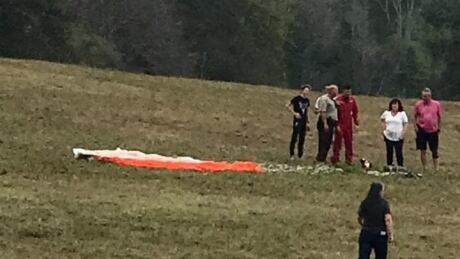 Capt. Kevin Domon-Grenier is shown with his parachute after ejecting from his Snowbird plane before it crashed in Georgia on Sunday. Capt. Kevin Domon-Grenier