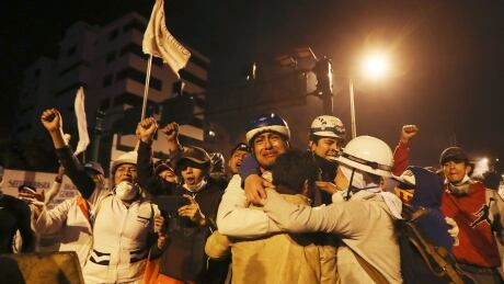 Indigenous and protesters celebrate the announcement that the government cancelled an austerity package that triggered violent protests, in Quito, Ecuador, Sunday, Oct. 13, 2019. Ecuadorian President Lenin Moreno and leaders of the country's indigenous peoples have struck a deal to cancel the disputed austerity package and end nearly two weeks of protests that have paralyzed the economy and left several people dead. (AP Photo/ Dolores Ochoa) Ecuador Political Crisis