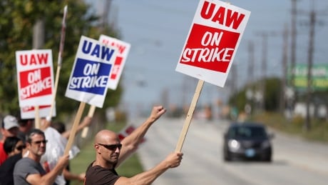 Carl Cvetkovich, front, joins dozens of fellow striking UAW workers outside the GM Parma facility in Parma, Ohio, Monday, Sept. 16, 2019. General Motors UAW Strike