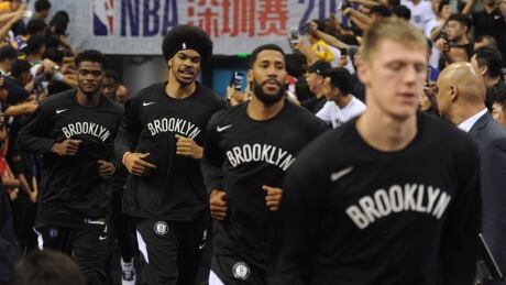 Brooklyn Nets players arrive for one of their games against the Los Angeles Lakers during the NBA China Series. Back home now, the Nets didn't offer comments on the on-going controversy. nets-china-101619