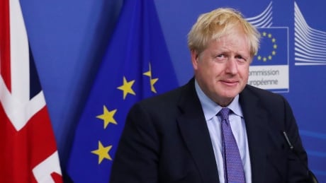 U.K. Prime Minister Boris Johnson looks on as he meets with European Commission President Jean-Claude Juncker, after agreeing on a new Brexit deal, at the sidelines of the EU leaders summit, in Brussels, on Thursday. EU-SUMMIT/
