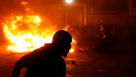 Demonstrators react as an improvised bonfire rages during a protest against the government in Valparaiso, Chile October 19, 2019. CHILE-PROTESTS/