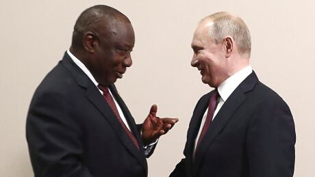 Russian President Vladimir Putin, right, shares a laugh South Africa's President, Cyril Ramaphosa prior to their talks in the Black Sea resort of Sochi. In Ramaphosa's country, two nuclear-capable bombers were being delivered Wednesday, courtesy of Russia. Russia Africa