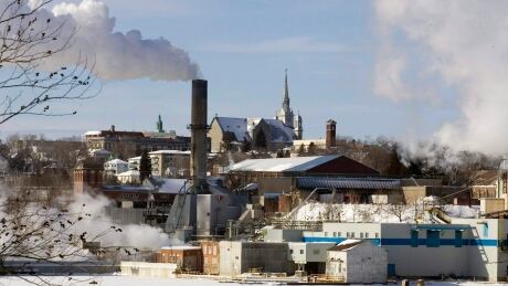 Smoke rises from the Abitibi-Consolidated mill in Shawinigan, Que. on Jan. 29, 2007. With global climate-change talks in limbo, Quebec says it's going ahead with a cap-and-trade program. The province says it's immediately joining the state of California, becoming the first Canadian province to start enforcing cap-and-trade regulations for carbon emissions. Climate Que 20111215