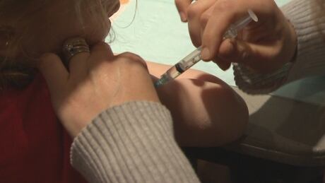 Child receiving flu shot